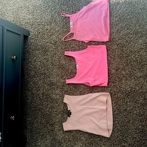 3 pink crop tops for ages 13-14. Very comfortable and cute.